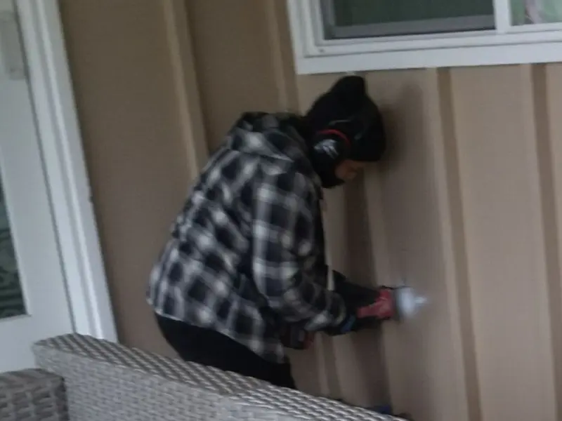 Professional electrician installing an exterior outlet in Canton
